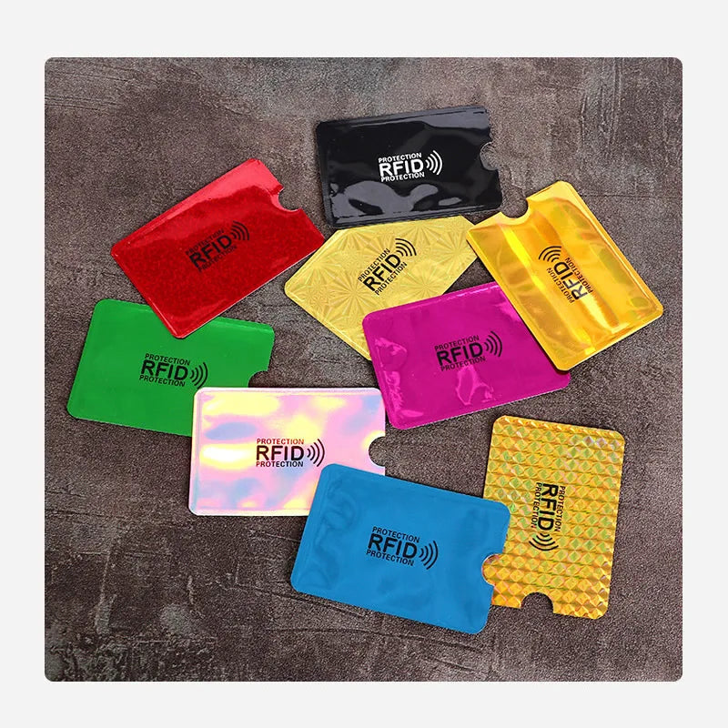 A collection of colorful anti-scan card sleeves for RFID protection, including red, yellow, green, purple, and blue.