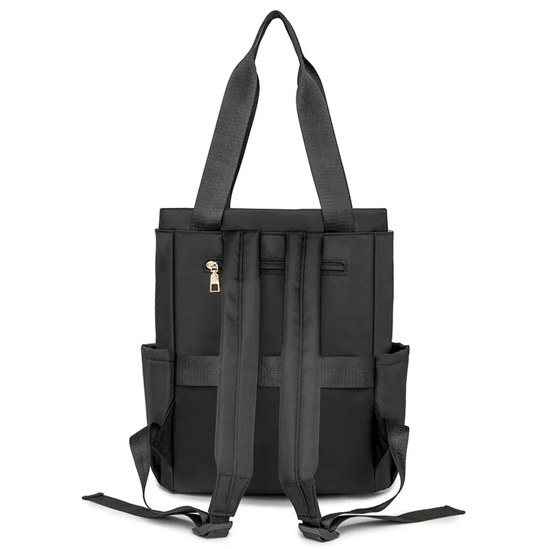 A black stylish quilted women's backpack tote with adjustable straps.