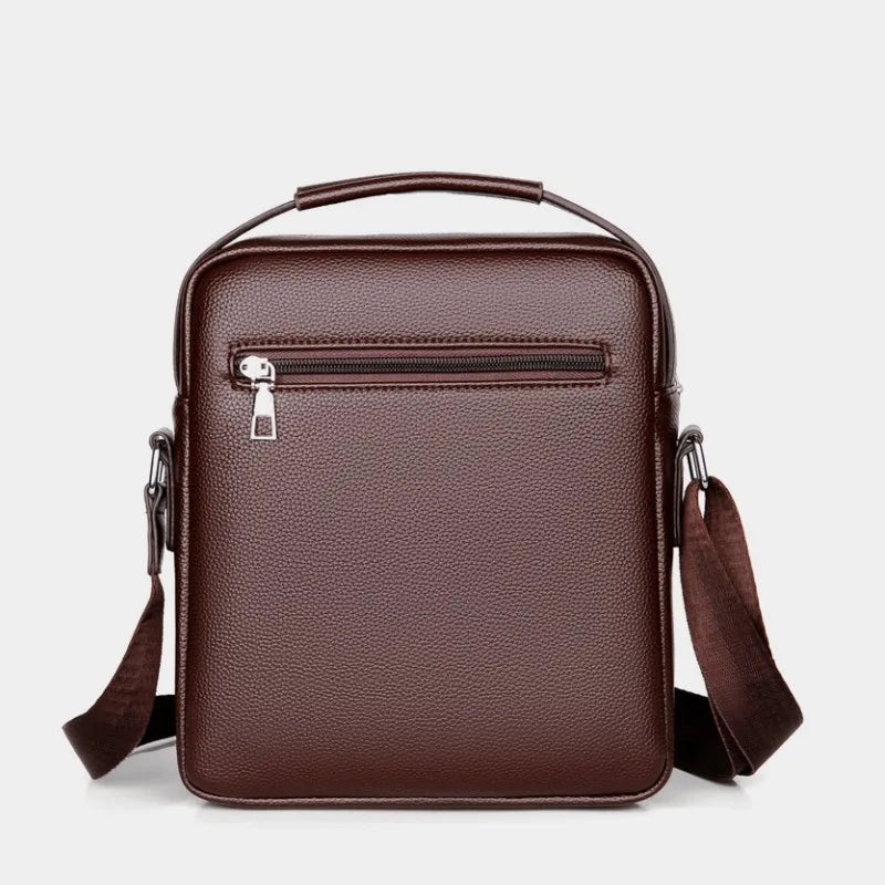 A dark brown vintage PU leather crossbody messenger bag with a zippered compartment and adjustable strap.