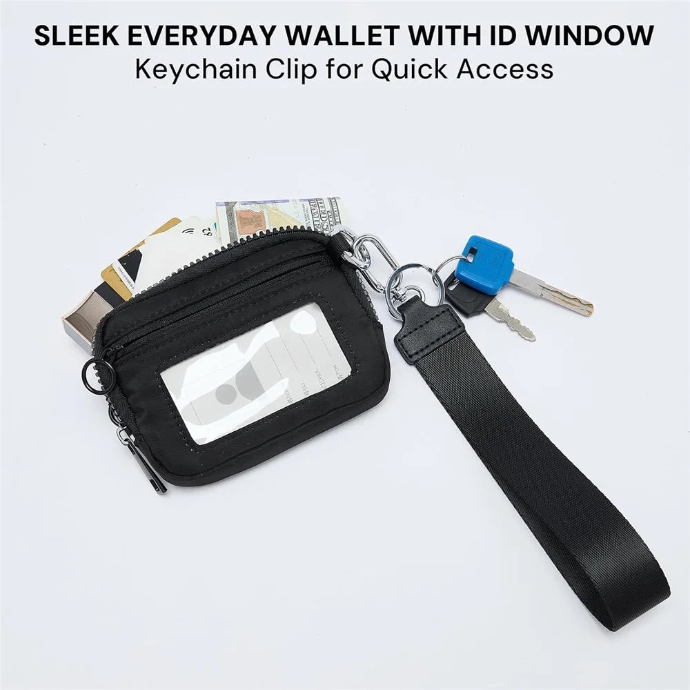 A black sleek everyday wallet with an ID window and a keychain clip attached to a strap.