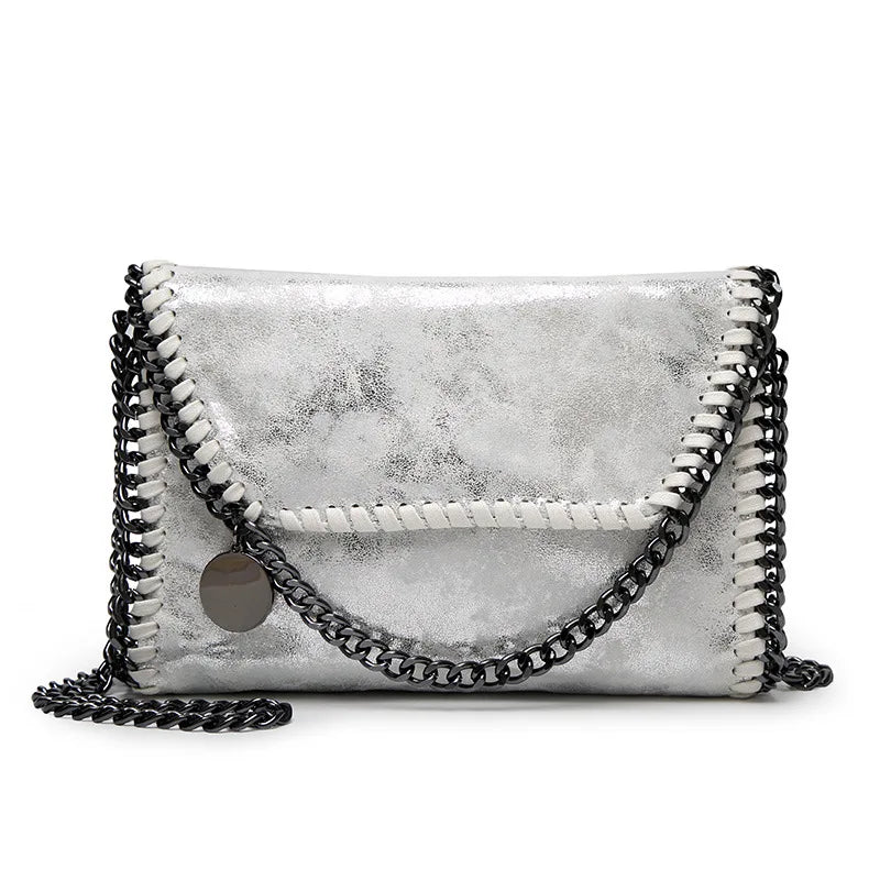 Silver metallic vintage flap crossbody bag with black chain strap