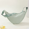 A light mint green women's preppy sling crossbody bag is displayed against a white background.