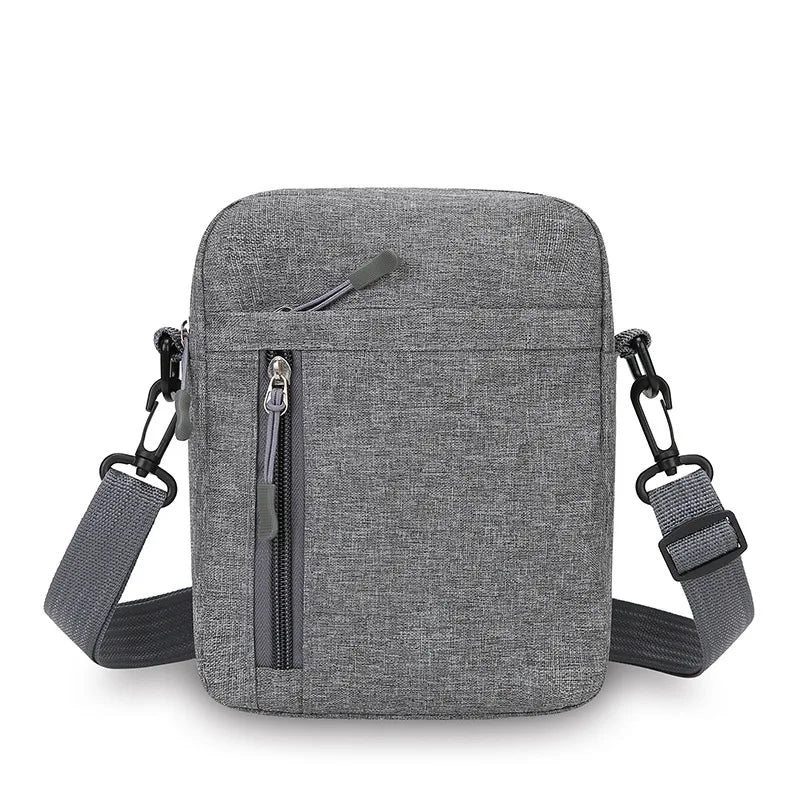 A gray lightweight nylon crossbody shoulder bag with a zippered front and adjustable strap.