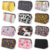 A collection of colorful and patterned portable cosmetic organizer bags in various designs.