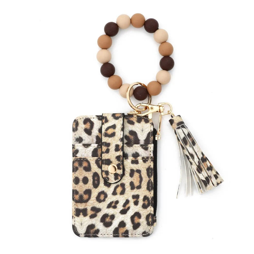 Boho beaded tassel keychain wristlet with card holder featuring a leopard print fabric.