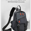 Sac de sport pour homme gris foncé avec sangle noire, sur fond blanc.