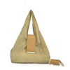Sac de courses pliable en nylon beige avec bandoulière et petit sac séparé.