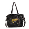 A black denim crossbody bag featuring embroidered text on the front pocket.