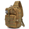 A tan sling backpack with olive green webbing and a black and white flag patch on the front.