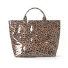 A brown leopard print tote bag with a handle, shown against a white background.