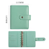 A light mint green leather ring binder notebook with a protective cover and a metal ring closure.
