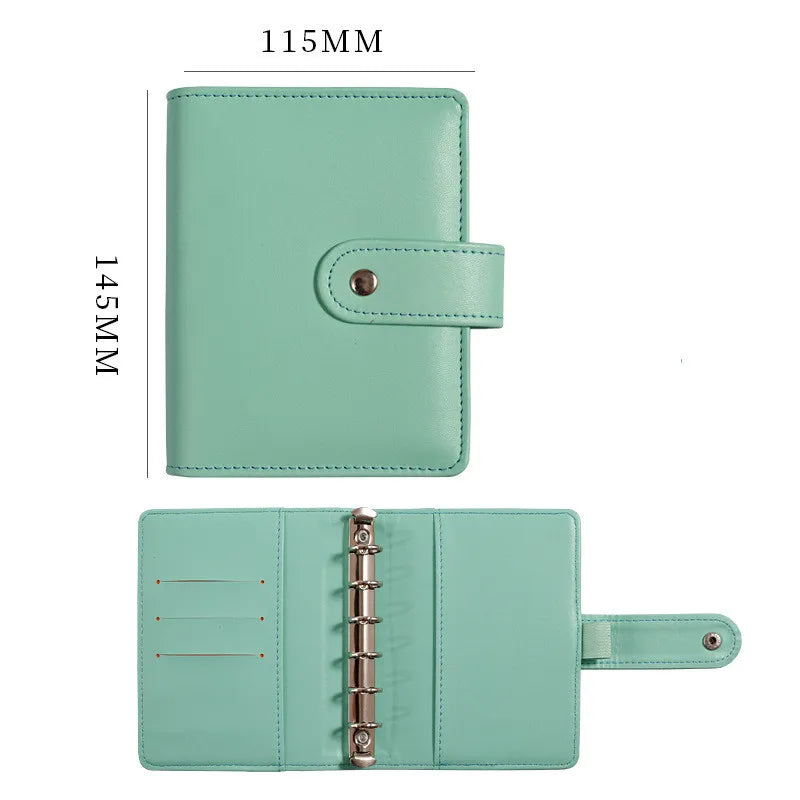 A light mint green leather ring binder notebook with a protective cover and a metal ring closure.