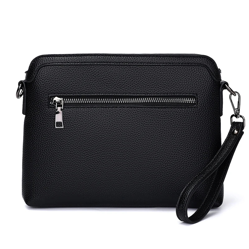 Black men's embossed crossbody clutch bag with a silver zipper and leather strap