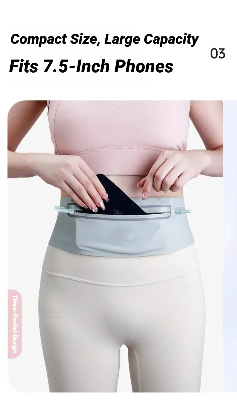 A woman is wearing a gray waist pack designed to fit 7.5-inch phones, shown against her torso.