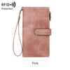 A pink classic trifold clutch wallet with a leather strap and RFID protection feature.