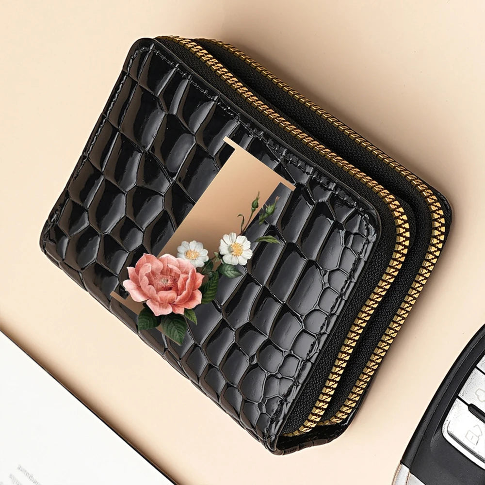 Black PU leather double-zip clutch wallet featuring a floral print and gold trim.