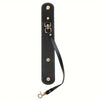 A black vintage leather glove holder strap with brass hardware.