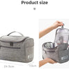 A gray portable toiletry bag shown in various sizes, including a larger zippered version and a smaller clear-top version.