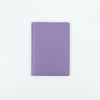 A purple PU leather passport holder with stitched edges.