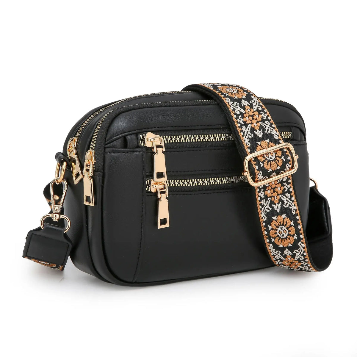 Black PU leather crossbody bag with gold hardware and a patterned strap