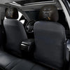 Two silicone car headrest covers in a dark brown color are shown installed in the back seat of a vehicle.