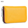 A yellow genuine leather accordion card holder wallet with a zipper closure and striped lining.