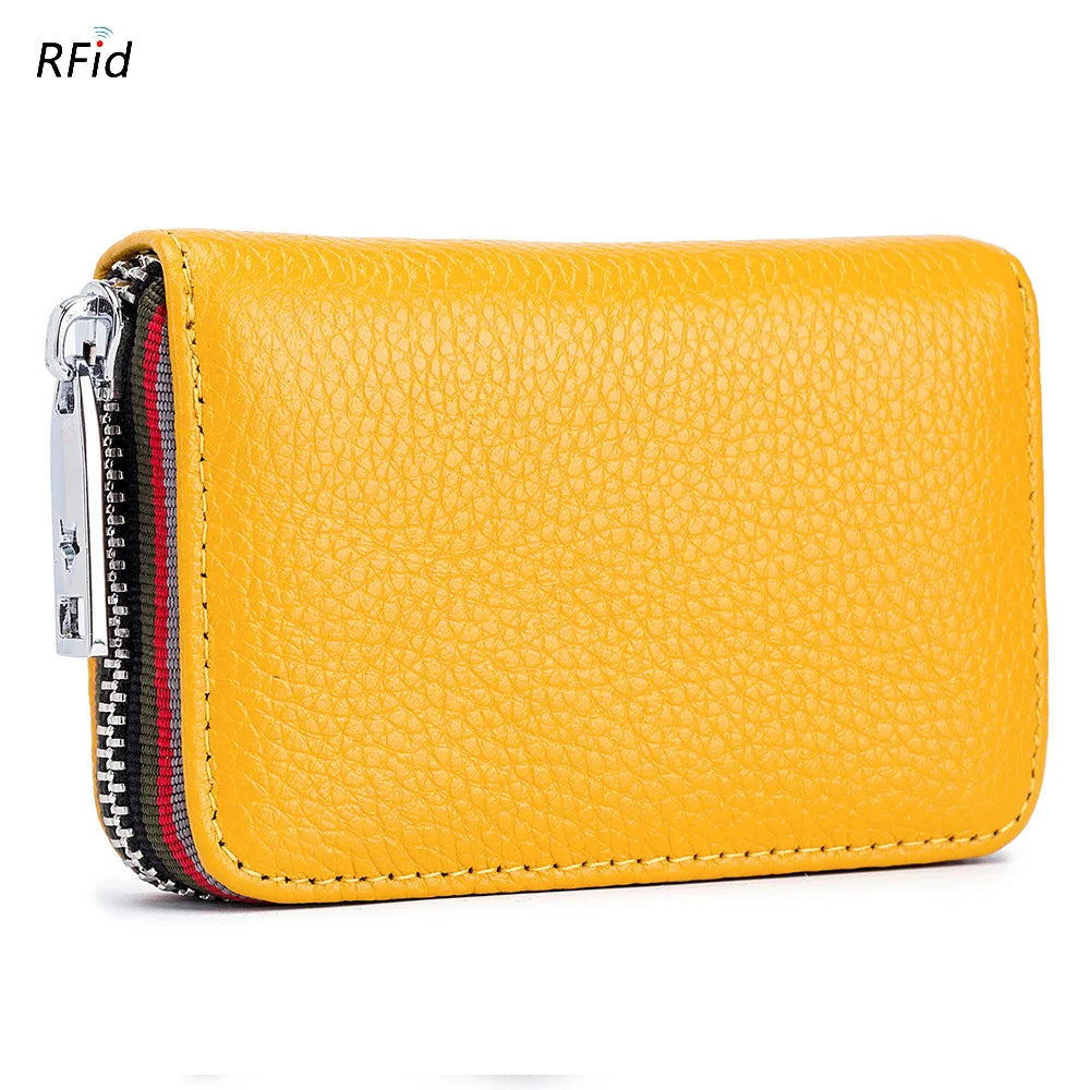 A yellow genuine leather accordion card holder wallet with a zipper closure and striped lining.