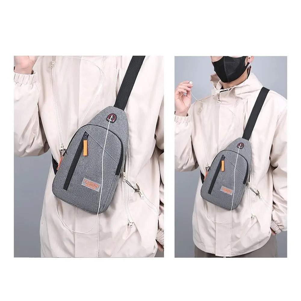A light gray lightweight oxford cloth crossbody bag worn by a person in a beige jacket.