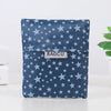 A dark blue fabric reusable shopping bag patterned with small silver stars, featuring a white label reading BAGCU.