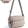A beige crossbody shoulder bag with a padded flap and a braided tassel detail.