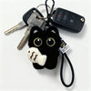 A set of black cat plush keychains and bag charms featuring a cute, fluffy cat head.