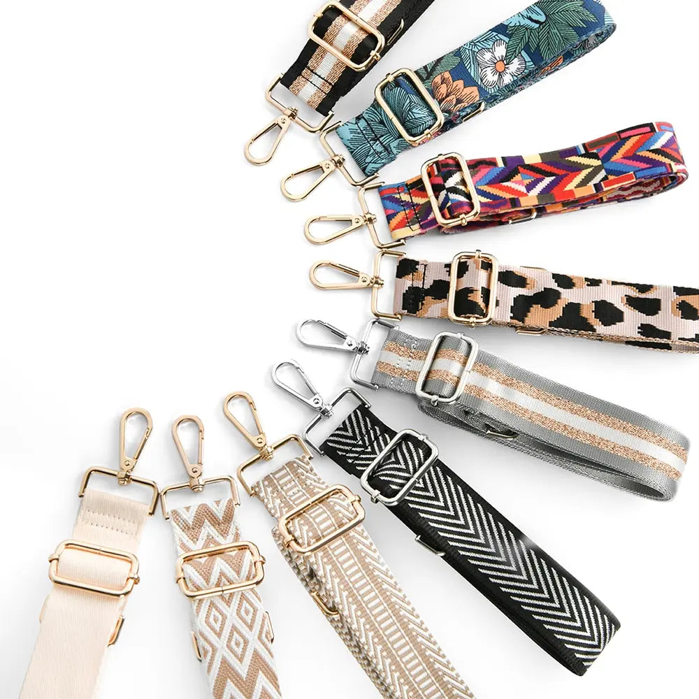 A collection of various patterned and textured nylon crossbody bag straps.