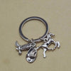 Silver keychain set featuring a western cowboy boot, hat, and horseshoe charms.