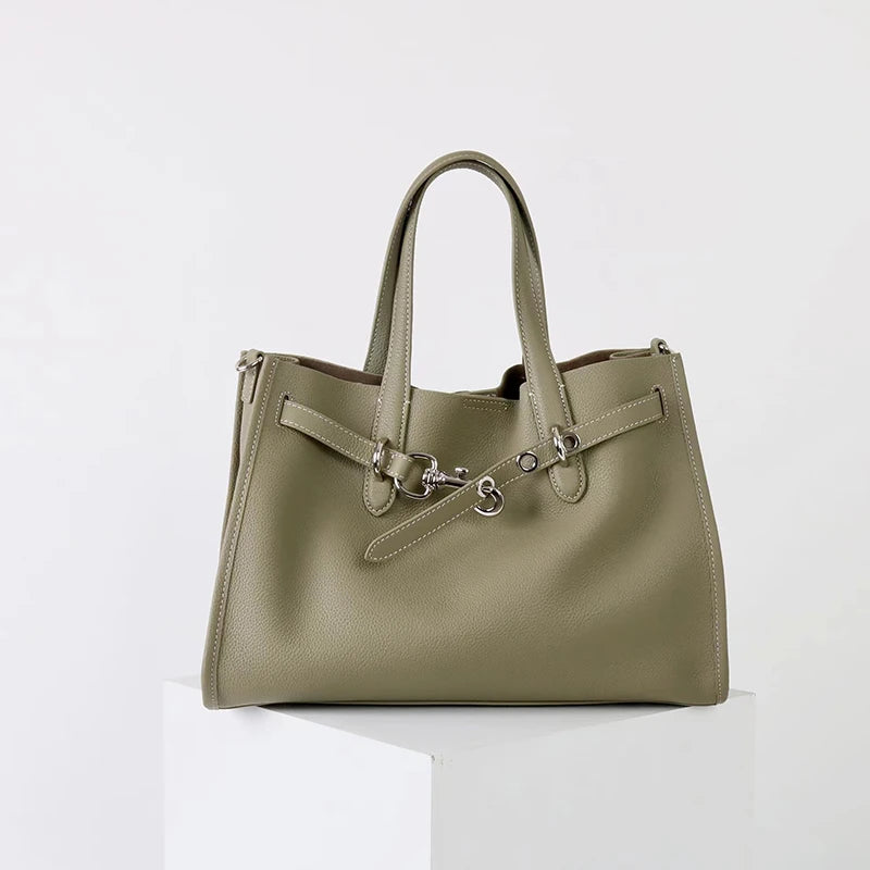 A light olive green genuine leather women's shoulder tote bag with a flap closure.