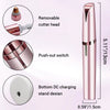A pink precision electric eyebrow trimmer featuring a removable cutter head, push-out switch, and bottom DC charging stand de