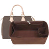 A brown felt purse organizer insert with a light tan handle is shown.
