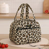 A patterned leopard print insulated lunch tote bag resting on a white surface.