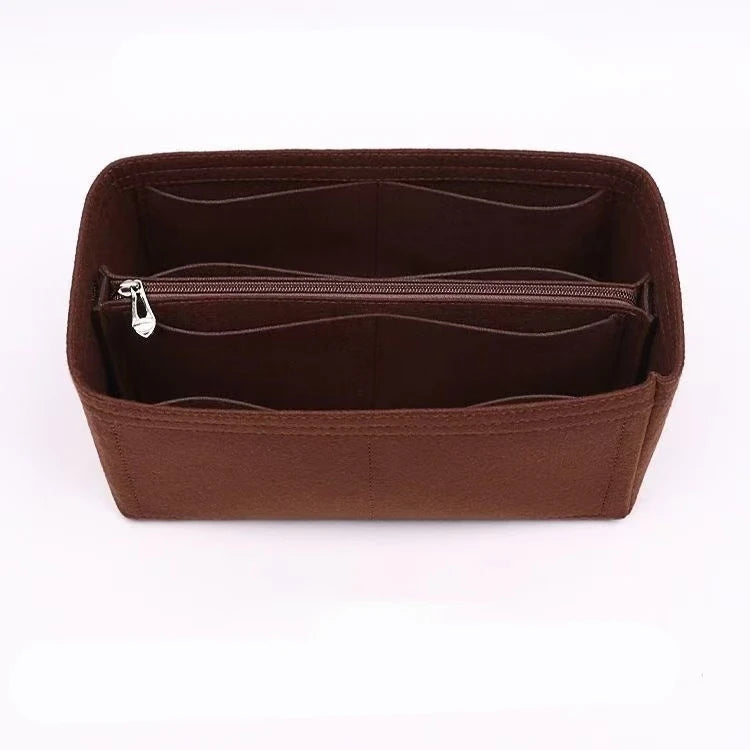 A brown felt purse organizer with internal zippered compartments.