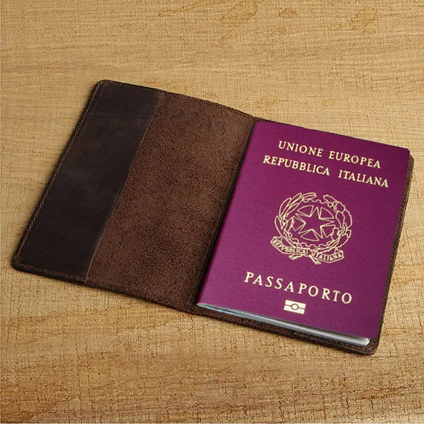 A dark brown leather passport holder with a purple cover and gold lettering for the European Union Republic of Italy passport