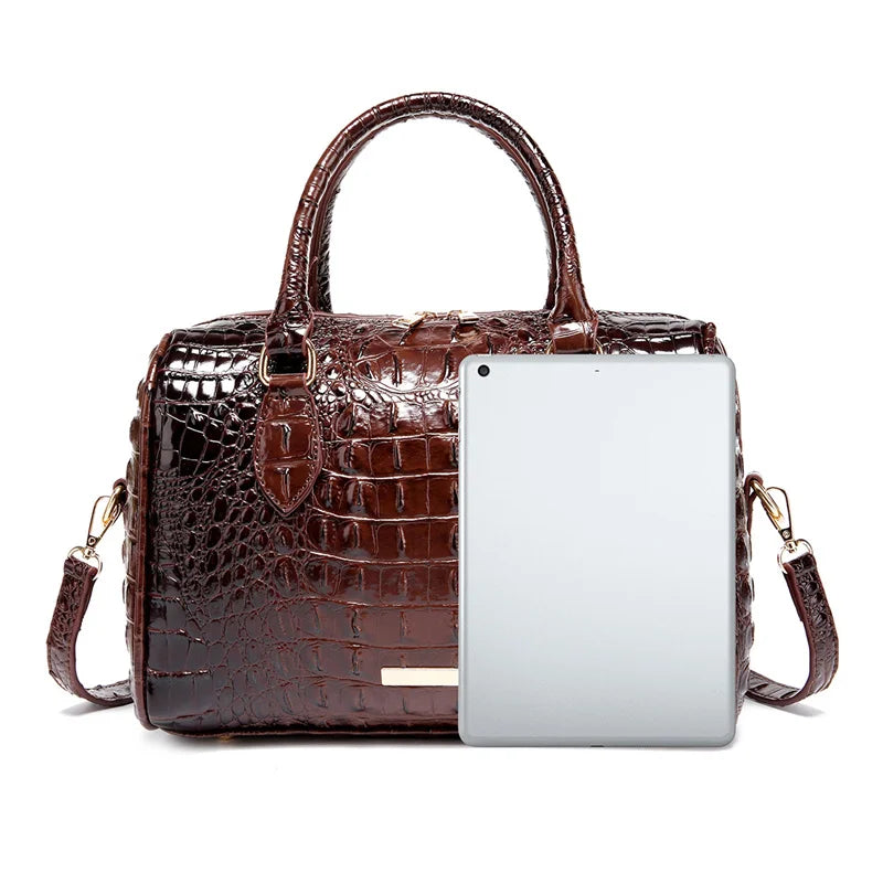 A brown crocodile pattern luxury handbag with a white smartphone inserted.