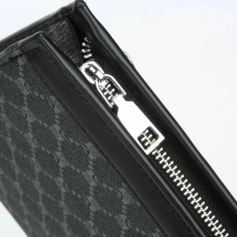 Close-up of a black leather handbag featuring silver hardware and a visible zipper detail.