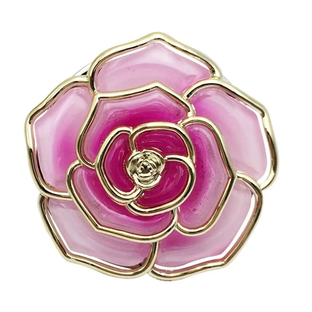 A pink and magenta rose-shaped metal fold-over bag hook with a gold rim.