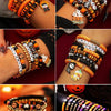 Assortment of Halloween themed polymer clay bracelets featuring spooky and seasonal designs