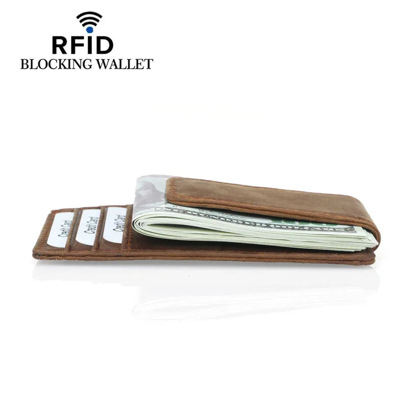 A brown leather wallet with a clear sleeve protecting cash cards and identification documents.