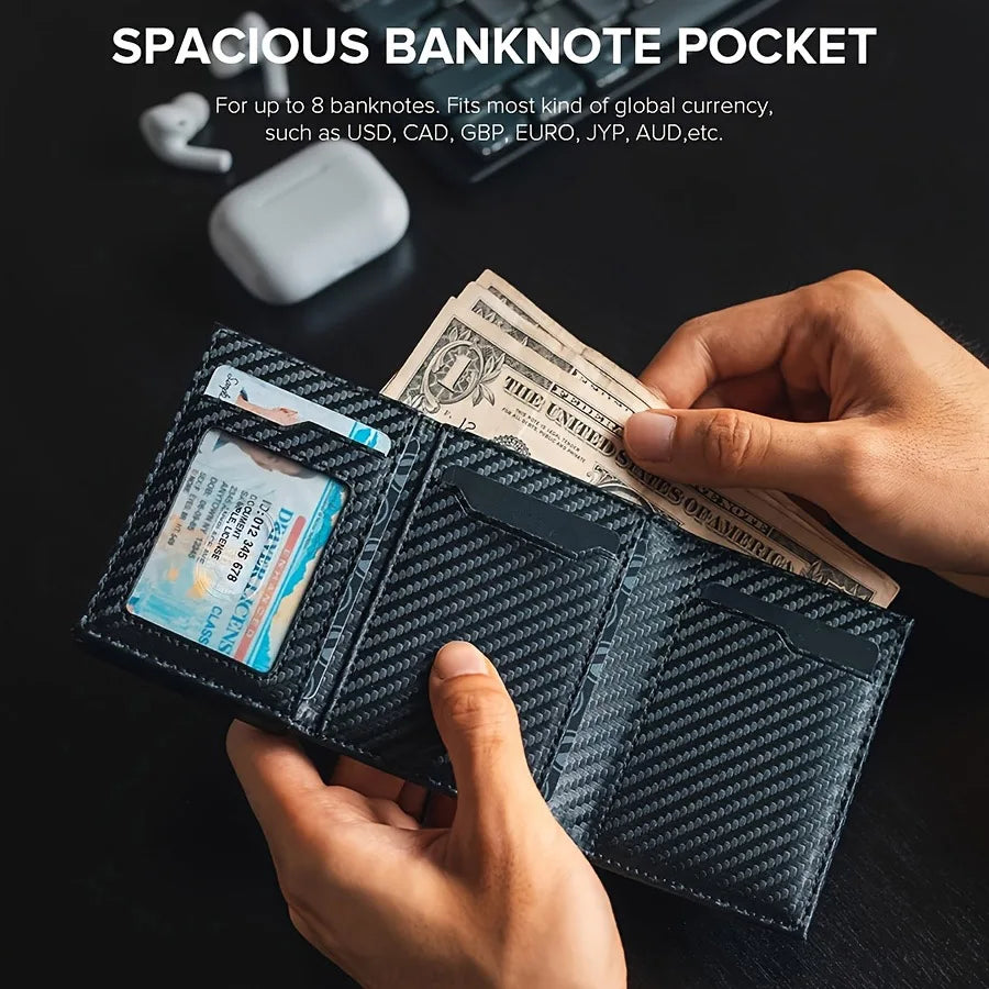 A hand holds a black card holder displaying various banknotes and cards.