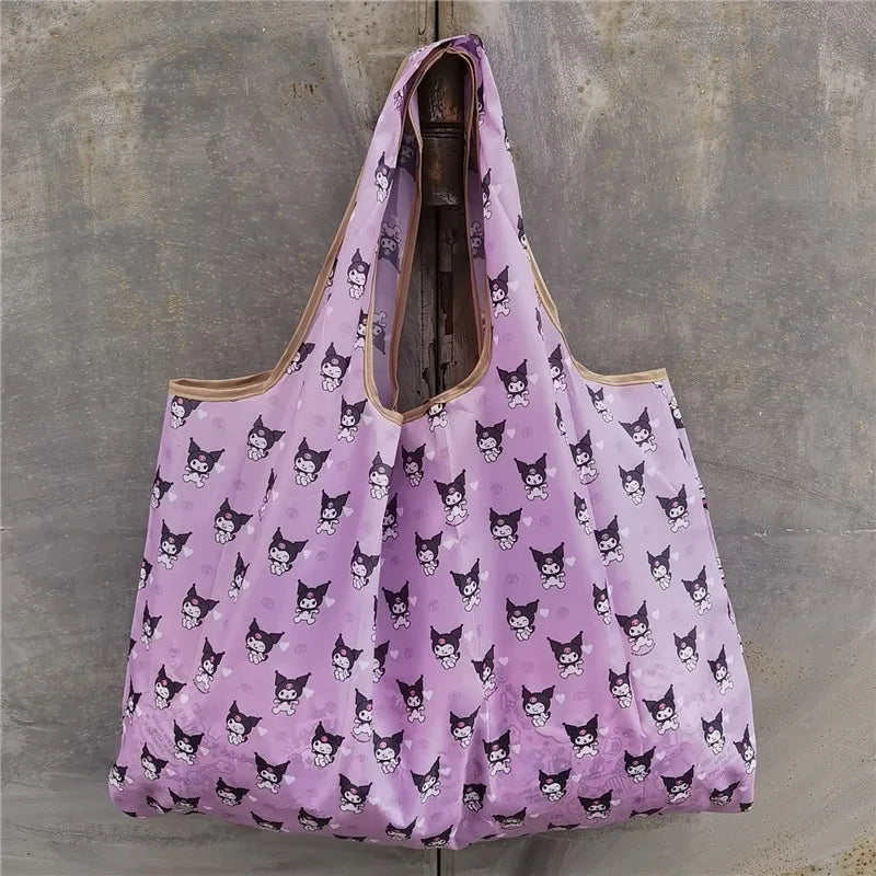 A purple reusable shopping bag featuring a pattern of black cat faces.