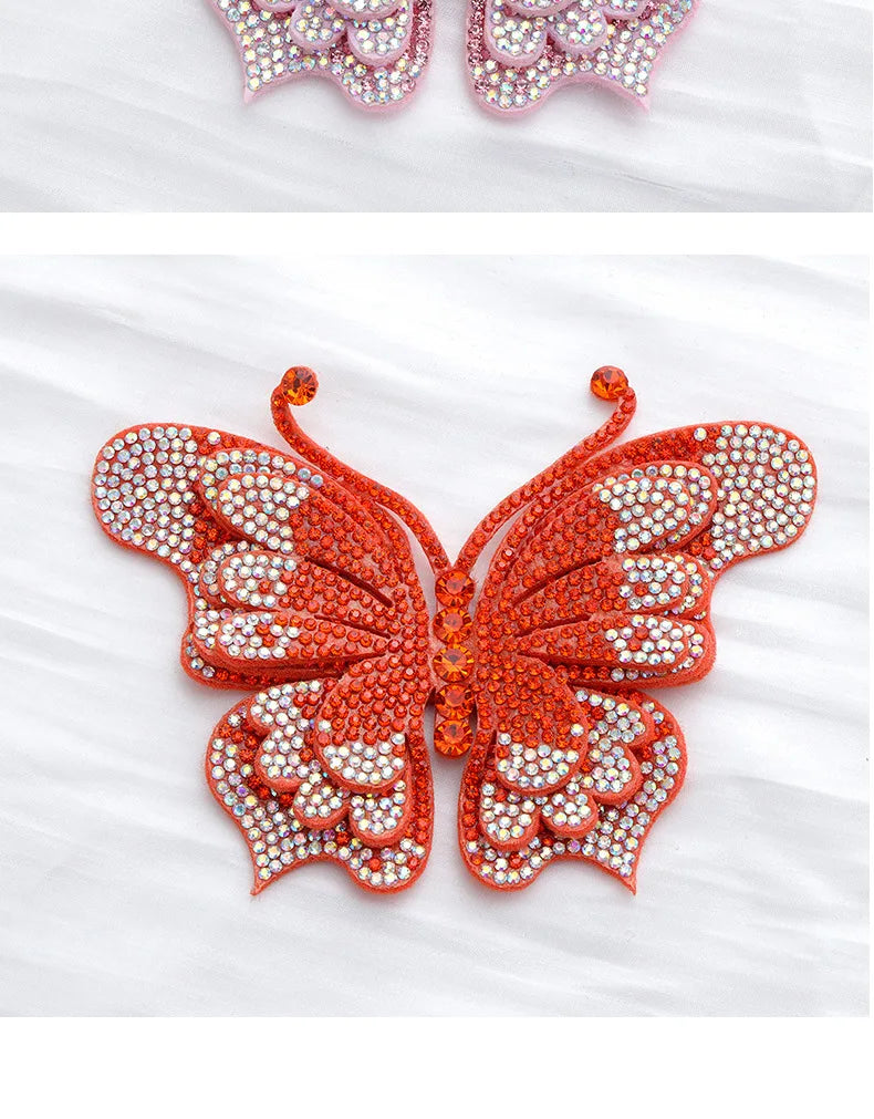 Orange rhinestone butterfly applique sticker with detailed wing patterns