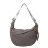 A gray canvas crossbody shoulder bag with adjustable straps.