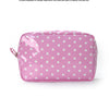 A pink cosmetic storage bag with white polka dots lying flat on a white background.