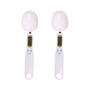 A pair of white precision digital kitchen scales for baking and measuring.